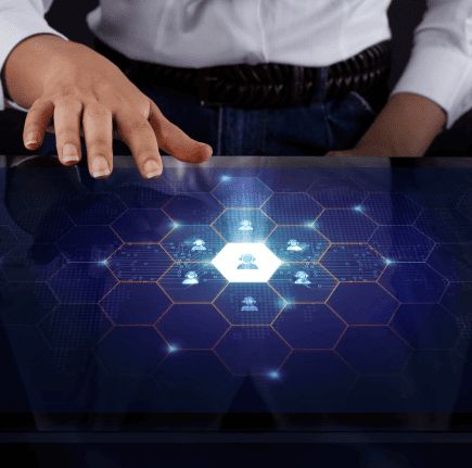 a person touching a tablet with an image of a network on it