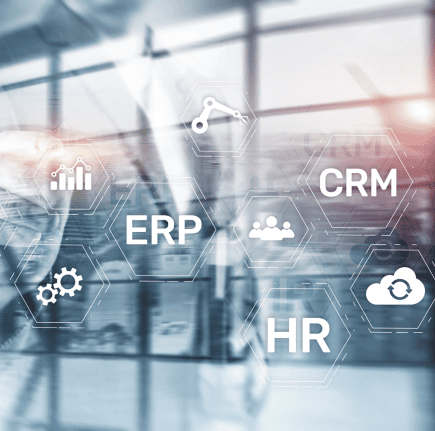 A person pointing to digital floating icons CRM, ERP, and HR on a glass window