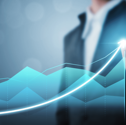Business professional pointing at an upward growth chart
