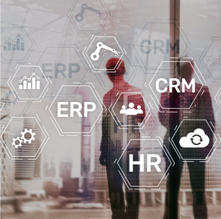 A group of people standing in front of a glass wall with the words ERP, CRM, and HR on it